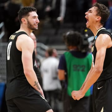 Colorado Buffaloes forward Tristan da Silva (23) and guard Luke O'Brien (0) celebrate after defeating the Florida Gators in the first round of the 2024 NCAA Tournament at Gainbridge FieldHouse. 