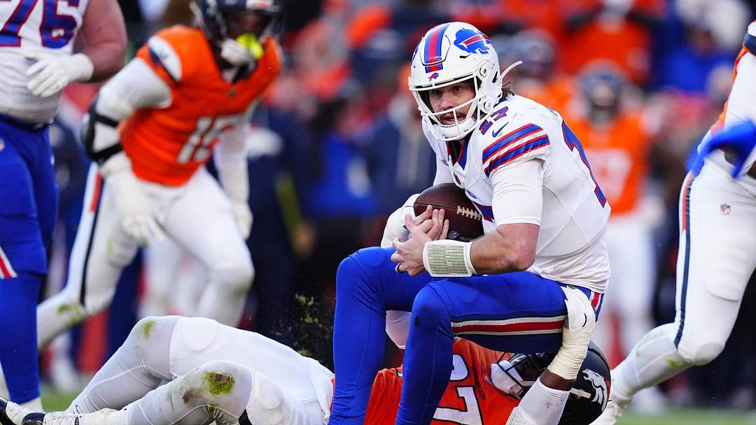 Jan 17, 2026; Denver, CO, USA; Denver Broncos defensive tackle Malcolm Roach (97) tackles Buffalo Bills quarterback Josh Allen (17) during the second quarter of an AFC Divisional Round playoff game at Empower Field at Mile High. Mandatory Credit: Ron Chenoy-Imagn Images