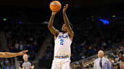 Nov 7, 2025; Los Angeles, California, USA;  UCLA Bruins guard Donovan Dent (2) shoots the ball during the second half against the Pepperdine Waves at Pauley Pavilion presented by Wescom Financial. Mandatory Credit: Kiyoshi Mio-Imagn Images