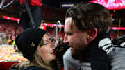  Recording artist Taylor Swift and Kansas City Chiefs tight end Travis Kelce react after the AFC Championship.