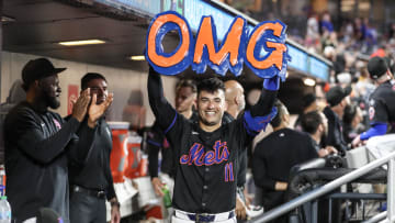 Jul 12, 2024; New York City, New York, USA;  New York Mets second baseman Jose Iglesias (11) celebrates in the dugout after hitting a solo home run in the fifth inning against the Colorado Rockies at Citi Field. Mandatory Credit: Wendell Cruz-USA TODAY Sports