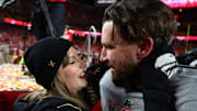 Jan 26, 2025; Kansas City, MO, USA; Recording artist Taylor Swift  and Kansas City Chiefs tight end Travis Kelce (87) react after the AFC Championship game against the Buffalo Bills at GEHA Field at Arrowhead Stadium. Mandatory Credit: Mark J. Rebilas-Imagn Images