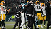 Jan 12, 2025; Philadelphia, Pennsylvania, USA; Philadelphia Eagles linebacker Nakobe Dean (17) is helped off the field against the Green Bay Packers during the first half in an NFC wild card game at Lincoln Financial Field. Mandatory Credit: Eric Hartline-Imagn Images