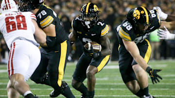 Iowa running back Kaleb Johnson (2) carries the ball against Wisconsin Saturday, Nov. 2, 2024 at Kinnick Stadium in Iowa City, Iowa.