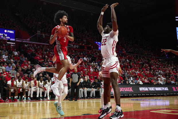 Mar 10, 2024; Piscataway, New Jersey, USA; Ohio State Buckeyes guard Taison Chatman (3) looks to pass as Rutgers Scarlet Knights center Emmanuel Ogbole (22) defends during the second half at Jersey Mike's Arena. Mandatory Credit: Vincent Carchietta-USA TODAY Sports