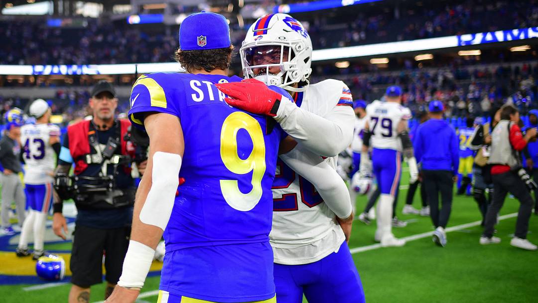 Dec 8, 2024; Inglewood, California, USA; Buffalo Bills running back Ty Johnson (26) meets with Los Angeles Rams quarterback Matthew Stafford (9) following the game at SoFi Stadium. Mandatory Credit: Gary A. Vasquez-Imagn Images