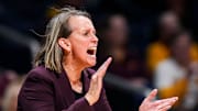 Minnesota Golden Gophers head coach Dawn Plitzuweit cheers on her team Wednesday, April 2, 2025, during the WBIT championship game between the Minnesota Golden Gophers and the Belmont Bruins at Hinkle Fieldhouse in Indianapolis.