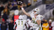 Nov 21, 2024; Atlanta, Georgia, USA; Georgia Tech Yellow Jackets quarterback Haynes King (10) throws a pass against the North Carolina State Wolfpack in the first quarter at Bobby Dodd Stadium at Hyundai Field. Mandatory Credit: Brett Davis-Imagn Images