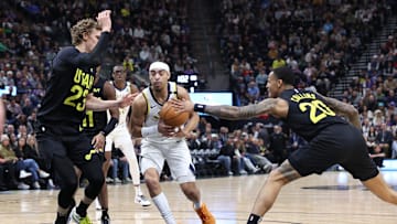 Jan 15, 2024; Salt Lake City, Utah, USA; Indiana Pacers guard Andrew Nembhard (2) drives against Utah Jazz forward Lauri Markkanen (23) and has the ball knocked away by forward John Collins (20) during the second quarter at Delta Center. Mandatory Credit: Rob Gray-Imagn Images