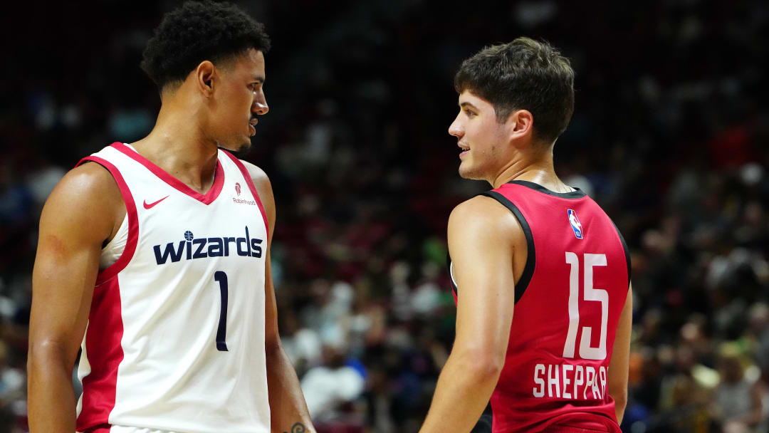 Jul 14, 2024; Las Vegas, NV, USA; Washington Wizards guard Johnny Davis (1) talks with Houston Rockets guard Reed Sheppard (15) during the first quarter at Thomas & Mack Center. Mandatory Credit: Stephen R. Sylvanie-USA TODAY Sports