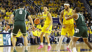Feb 21, 2025; Ann Arbor, Michigan, USA; Michigan Wolverines guard Justin Pippen (10) handles the ball during the first half against the Michigan State Spartans at Crisler Center. Mandatory Credit: Brian Bradshaw Sevald-Imagn Images