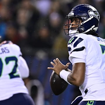 Dec 26, 2024; Chicago, Illinois, USA; Seattle Seahawks quarterback Geno Smith (7) looks to pass against the Chicago Bears during the first quarter at Soldier Field. Mandatory Credit: Daniel Bartel-Imagn Images