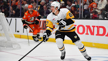Oct 14, 2025; Anaheim, California, USA; Pittsburgh Penguins right wing Rickard Rakell (67) controls the puck against the Anaheim Ducks during the second period at Honda Center. Mandatory Credit: Gary A. Vasquez-Imagn Images