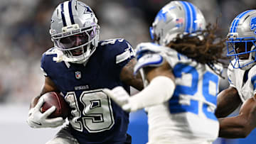 Dec 4, 2025; Detroit, Michigan, USA; Dallas Cowboys wide receiver Ryan Flournoy (19) runs against Detroit Lions cornerback D.J. Reed (4) and cornerback Avonte Maddox (29) during the second half at Ford Field.