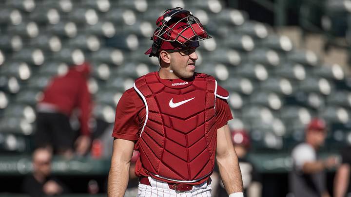 Feb 6, 2026; Fayetteville, AR, USA;  Arkansas Razorbacks catcher Ryder Helfrick (27) looks back towards the field as he walks to the dugout during the first inning of the Arkansas Razorbacks scrimmage at Baum-Walker Stadium. Mandatory Credit: Brett Rojo-Imagn Images