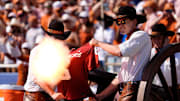 Texas fans shoot a cannon through a Baker Mayfield jersey in the first half of the Red River Rivalry college football game between the University of Oklahoma Sooners and the Texas Longhorn at the Cotton Bowl Stadium in Dallas, Texas, Saturday, Oct., 12, 2024.
