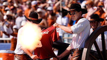 Texas fans shoot a cannon through a Baker Mayfield jersey in the first half of the Red River Rivalry college football game between the University of Oklahoma Sooners and the Texas Longhorn at the Cotton Bowl Stadium in Dallas, Texas, Saturday, Oct., 12, 2024.