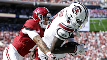 Oct 12, 2024; Tuscaloosa, Alabama, USA;  South Carolina Gamecocks wide receiver Nyck Harbor (8) catches a pass for a touchdown as Alabama Crimson Tide defensive back Domani Jackson (1) defends during the second half at Bryant-Denny Stadium. Mandatory Credit: Butch Dill-Imagn Images