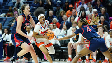 Mar 23, 2024; Storrs, Connecticut, USA; Syracuse Orange guard Dyaisha Fair (2) drives the ball against Arizona Wildcats guard Helena Pueyo (13) and guard Sophie Burrows (4) in the second half at Harry A. Gampel Pavilion. Mandatory Credit: David Butler II-Imagn Images