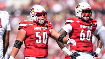 Louisville Cardinals offensive lineman Pete Nygra (50) and Louisville Cardinals offensive lineman Rasheed Miller (60) during the Cards' 51-17 win over Eastern Kentucky University at the Cardinals' season opener Saturday, August 30, 2025 at L&N Federal Credit Union Stadium in Louisville, Kentucky.
