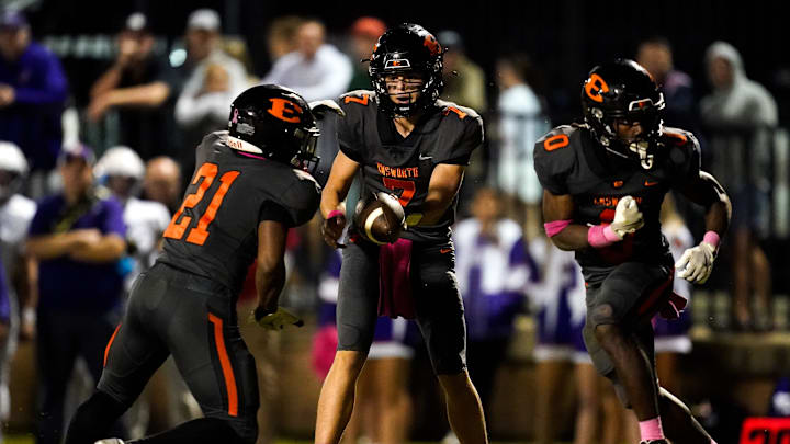 Ensworth's Taylor Hasselbeck (7) hands off to EJ Gibson (21) against Father Ryan during the second half at Ensworth High School in Nashville, Tenn., Friday, Oct. 11, 2024. Ensworth's Taylor Hasselbeck (7) hands off to EJ Gibson (21) against Father Ryan during the second half at Ensworth High School in Nashville, Tenn., Friday, Oct. 11, 2024.