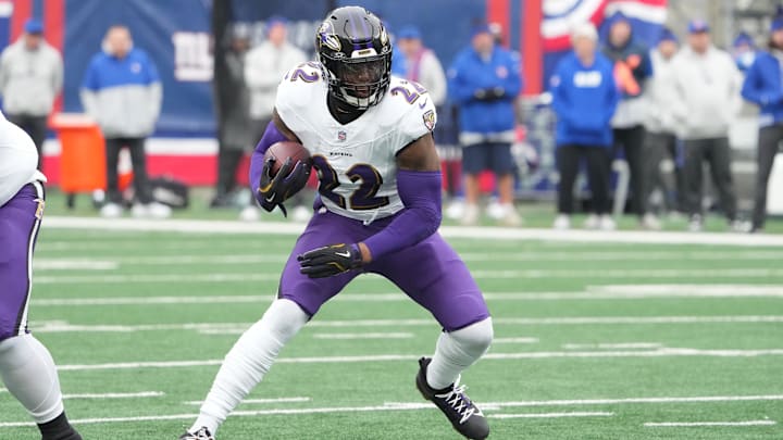 Dec 15, 2024; East Rutherford, New Jersey, USA; Baltimore Ravens running back Derrick Henry (22) runs against the New York Giants during the first half at MetLife Stadium. Mandatory Credit: Robert Deutsch-Imagn Images