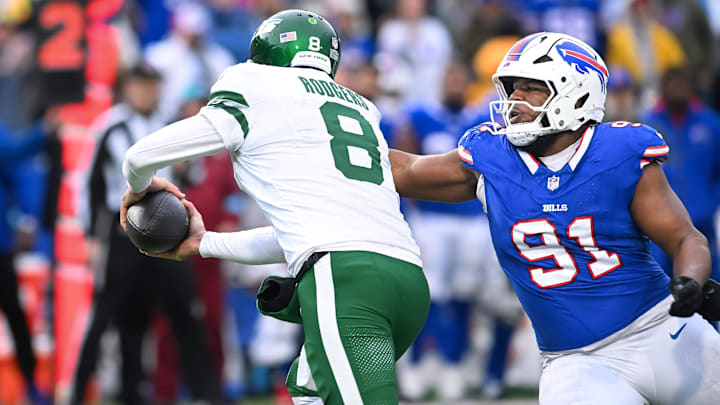 Dec 29, 2024; Orchard Park, New York, USA; Buffalo Bills defensive tackle Ed Oliver (91) sacks New York Jets quarterback Aaron Rodgers (8)