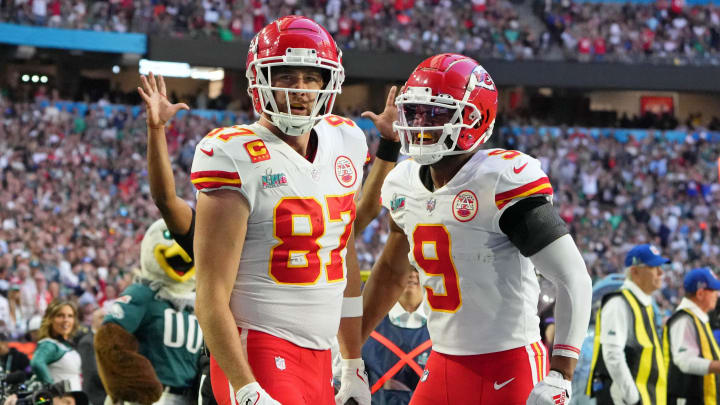 Feb 12, 2023; Glendale, Arizona, US; Kansas City Chiefs tight end Travis Kelce (87) celebrates with wide receiver JuJu Smith-Schuster (9) after making a catch for a touchdown against the Philadelphia Eagles during the first quarter of Super Bowl LVII at State Farm Stadium. Mandatory Credit: Kirby Lee-USA TODAY Sports