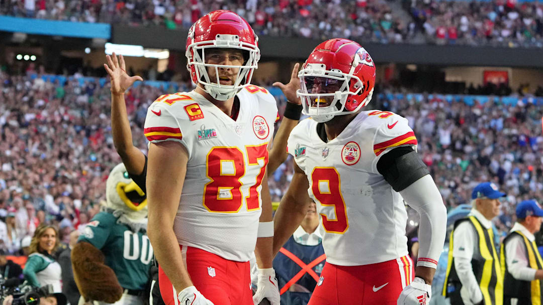 Feb 12, 2023; Glendale, Arizona, US; Kansas City Chiefs tight end Travis Kelce (87) celebrates with wide receiver JuJu Smith-Schuster (9) after making a catch for a touchdown against the Philadelphia Eagles during the first quarter of Super Bowl LVII at State Farm Stadium. Mandatory Credit: Kirby Lee-Imagn Images