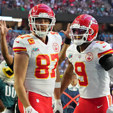 Feb 12, 2023; Glendale, Arizona, US; Kansas City Chiefs tight end Travis Kelce (87) celebrates with wide receiver JuJu Smith-Schuster (9) after making a catch for a touchdown against the Philadelphia Eagles during the first quarter of Super Bowl LVII at State Farm Stadium. Mandatory Credit: Kirby Lee-Imagn Images