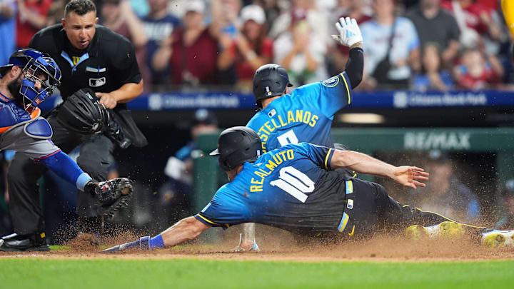Jun 20, 2025; Philadelphia, Pennsylvania, USA; Philadelphia Phillies catcher J.T. Realmuto (10) and outfielder Nick Castellanos (8) advance home to score against the New York Mets in the seventh inning at Citizens Bank Park. Mandatory Credit: Kyle Ross-Imagn Images