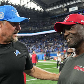 Detroit Lions head coach Dan Campbell talks to Tampa Bay Buccaneers head coach Todd Bowels 