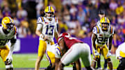 Nov 9, 2024; Baton Rouge, Louisiana, USA;  LSU Tigers quarterback Garrett Nussmeier (13) looks over the Alabama Crimson Tide defense during the second half at Tiger Stadium. Mandatory Credit: Stephen Lew-Imagn Images