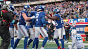 Dec 29, 2024; East Rutherford, New Jersey, USA; New York Giants quarterback Drew Lock (2) celebrates with teammates after a rushing touchdown during the fourth quarter against the Indianapolis Colts at MetLife Stadium.  