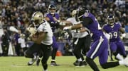 Oct 21, 2018; Baltimore, MD, USA;  New Orleans Saints wide receiver Michael Thomas (13) runs after the catch as Baltimore Ravens defensive back Jimmy Smith (22) defends during the fourth quarter at M&T Bank Stadium. Mandatory Credit: Tommy Gilligan-USA TODAY Sports