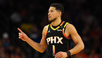 Apr 9, 2025; Phoenix, Arizona, USA; Phoenix Suns guard Devin Booker (1) reacts after a play against the Oklahoma City Thunder during the first half at Footprint Center. Mandatory Credit: Mark J. Rebilas-Imagn Images