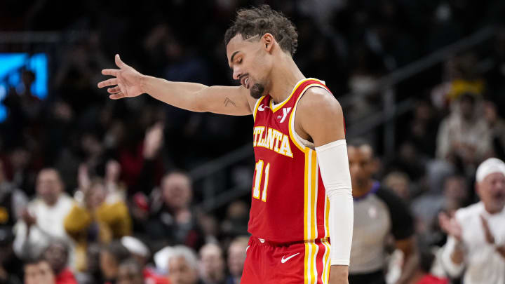 Nov 22, 2023; Atlanta, Georgia, USA; Atlanta Hawks guard Trae Young (11) reacts after making a three point shot against the Brooklyn Nets during overtime at State Farm Arena. Mandatory Credit: Dale Zanine-USA TODAY Sports