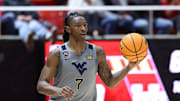 Mar 4, 2025; Salt Lake City, Utah, USA; West Virginia Mountaineers guard Javon Small (7) brings the ball up the court against the Utah Utes during the first half at Jon M. Huntsman Center. Mandatory Credit: Rob Gray-Imagn Images