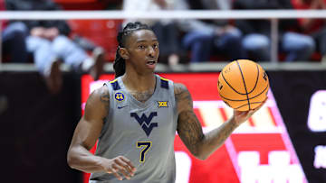 Mar 4, 2025; Salt Lake City, Utah, USA; West Virginia Mountaineers guard Javon Small (7) brings the ball up the court against the Utah Utes during the first half at Jon M. Huntsman Center. Mandatory Credit: Rob Gray-Imagn Images