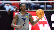 Mar 4, 2025; Salt Lake City, Utah, USA; West Virginia Mountaineers guard Javon Small (7) brings the ball up the court against the Utah Utes during the first half at Jon M. Huntsman Center. Mandatory Credit: Rob Gray-Imagn Images
