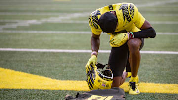 Oregon wide receiver Isaah Crocker takes a moment to honor Spencer Webb before the Ducks    home opener at Autzen Stadium Saturday, Sept. 10, 2022.