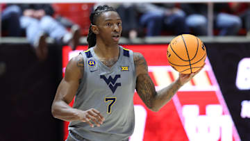 Mar 4, 2025; Salt Lake City, Utah, USA; West Virginia Mountaineers guard Javon Small (7) brings the ball up the court against the Utah Utes during the first half at Jon M. Huntsman Center. Mandatory Credit: Rob Gray-Imagn Images