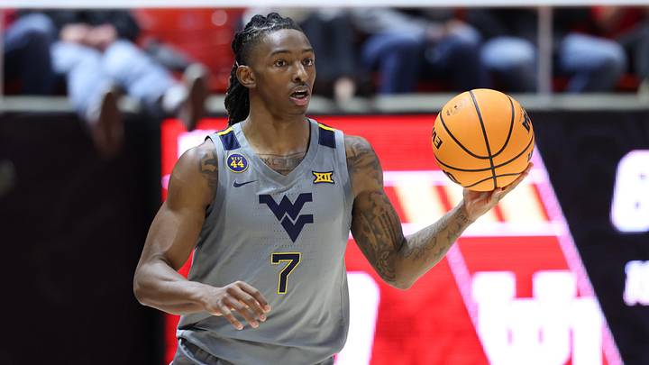Mar 4, 2025; Salt Lake City, Utah, USA; West Virginia Mountaineers guard Javon Small (7) brings the ball up the court against the Utah Utes during the first half at Jon M. Huntsman Center. Mandatory Credit: Rob Gray-Imagn Images