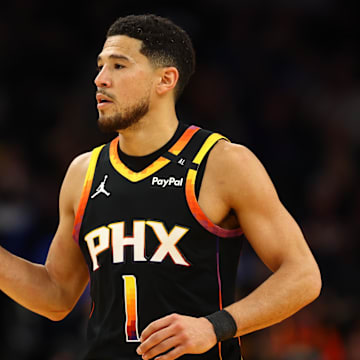 Apr 9, 2025; Phoenix, Arizona, USA; Phoenix Suns guard Devin Booker (1) reacts after a play against the Oklahoma City Thunder during the first half at Footprint Center. Mandatory Credit: Mark J. Rebilas-Imagn Images