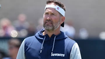 Dallas Cowboys coach Brian Schottenheimer watches quarterback Dak Prescott (4) at training camp at the River Ridge Fields.