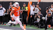 Oklahoma State quarterback Hauss Hejny (8) runs the ball for a touchdown in the first quarter during an NCAA football game between Oklahoma State (OSU) and UT Martin in Stillwater, Okla., on Thursday, Aug. 28, 2025.