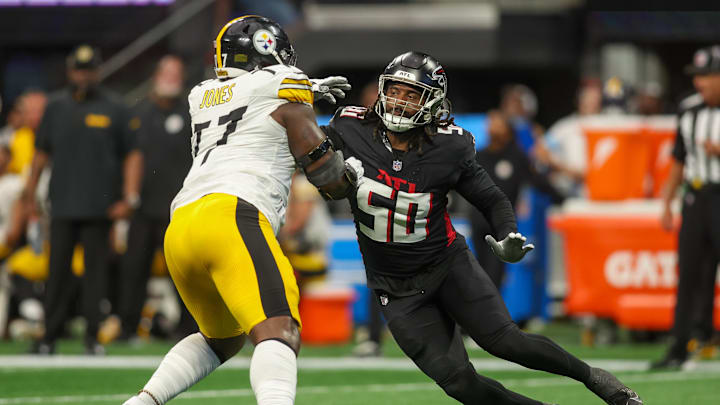 Sep 8, 2024; Atlanta, Georgia, USA; Pittsburgh Steelers offensive tackle Broderick Jones (77) blocks Atlanta Falcons defensive end James Smith-Williams (50) in the second quarter at Mercedes-Benz Stadium. Mandatory Credit: Brett Davis-Imagn Images