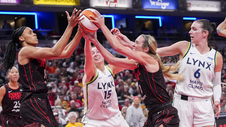 Sep 9, 2025; Indianapolis, Indiana, USA; Indiana Fever forward Brianna Turner (11), Minnesota Lynx forward Jessica Shepard (15), Indiana Fever guard Lexie Hull (10) and Minnesota Lynx forward Bridget Carleton (6) go for the rebound during the game at Gainbridge Fieldhouse. Mandatory Credit: Grace Smith-USA TODAY Network via Imagn Images