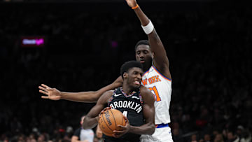 Nov 24, 2025; Brooklyn, New York, USA; Brooklyn Nets guard Drake Powell (4) goes to the basket against New York Knicks forward Mohamed Diawara (51) during the second half at Barclays Center. Mandatory Credit: Vincent Carchietta-Imagn Images