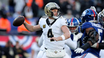 Dec 8, 2024; East Rutherford, New Jersey, USA; New Orleans Saints quarterback Derek Carr (4) drops back to pass against the New York Giants during the third quarter at MetLife Stadium. Mandatory Credit: Brad Penner-Imagn Images